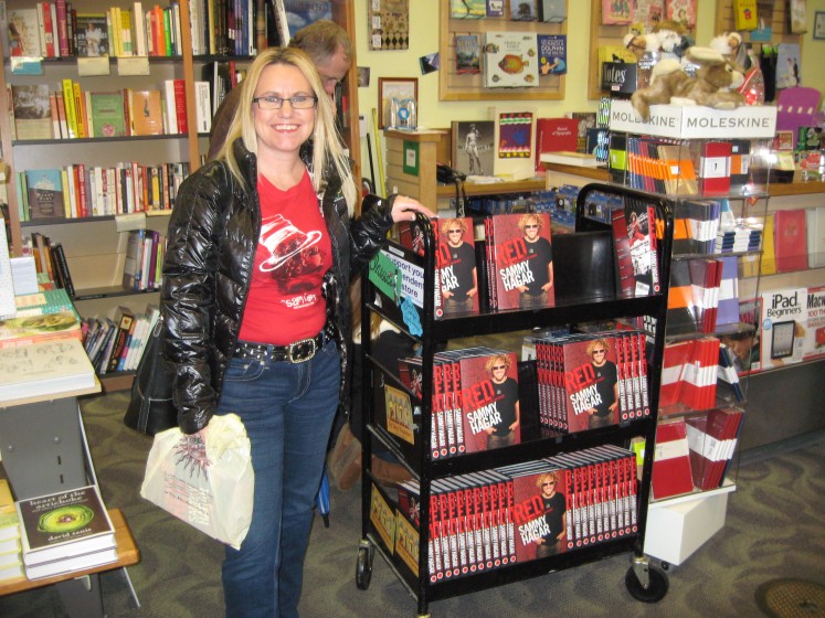 Posing with the Red Rocker books